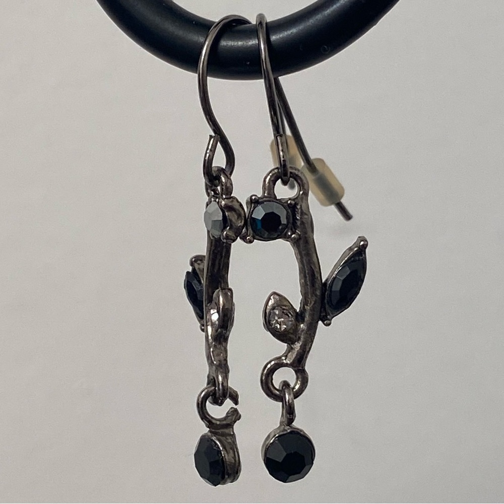 Vintage style silver tone and black rhinestone floral design earrings. Pre-owned
